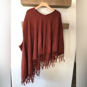 Burnt orange/Rust Pancho,asymmetrical cut with fringe detail•Slouchy boho style